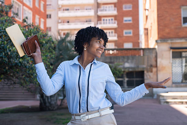 istock Happy young woman dancing in urban environment 2239852604
