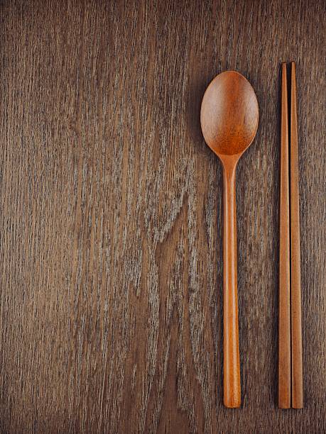 Brown wooden spoon and chopsticks, utensils