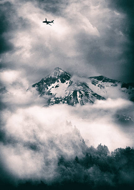 Transportation image of airplane over high mountains