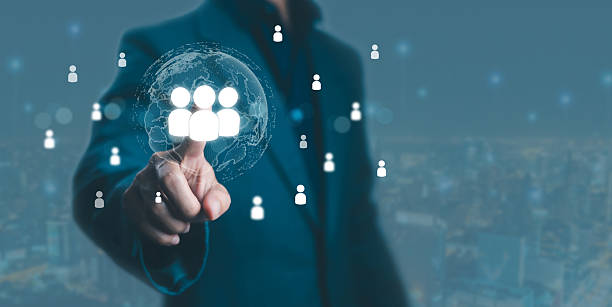 istock Businessman touching digital human resource icon with global network connection, representing worldwide recruitment, HR management, and workforce technology in modern business innovation. 2239857792