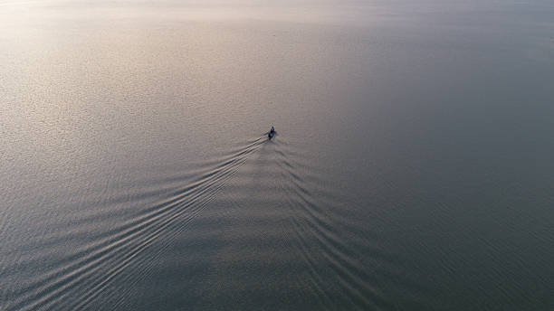 istock Aerial View of Boat Sailing on Water 2239858075