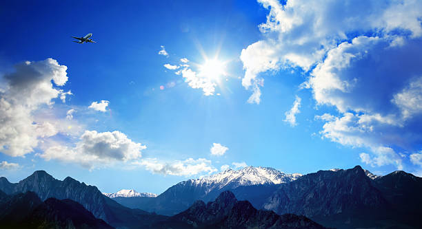 Transportation image of airplane over high mountains in Antalya, Turkey
