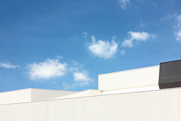 istock architecture design square shape corrugated wall geometric buiding. The factory warehouse is exterior decorated with corrugated texture to create a point of interest with beautyl 2239866346