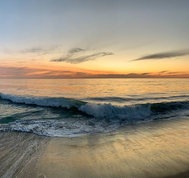 istock Dynamic Ocean Wave Crashing at Dusk in Carlsbad 2239869492