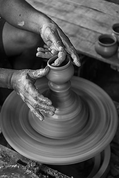 istock Artist making a pot on a pottery wheel 2239869703