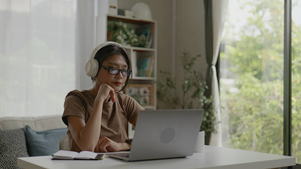 istock Asian Woman Working From Home Using Laptop .4k 2239872464