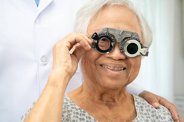 istock Asian senior woman wearing ophthalmic vision eye test and using optical trial frame. 2239872497
