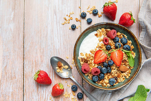 istock Healthy breakfast bowl with granola and fresh berries 2239872799