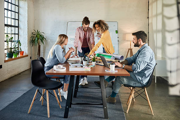 istock Young creative team having a meeting at casual office. 2239873511