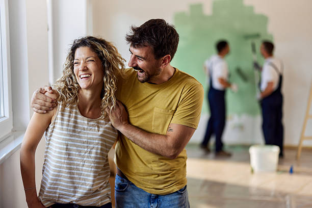istock Cheerful couple enjoying during their home renovation process. 2239874131