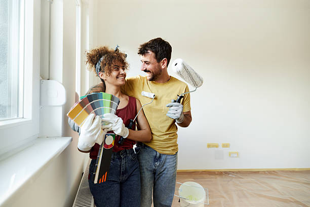 istock Happy couple talking during home renovation process. 2239874967