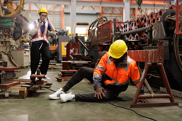 istock Worker injured in factory accident while colleague calls for help 2239879357