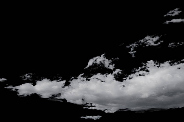 istock white fluffy clouds isolated on a black background, clipart 2239879778