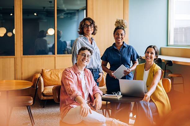 istock Group of diverse adults gathered in a modern office workspace 2239881262