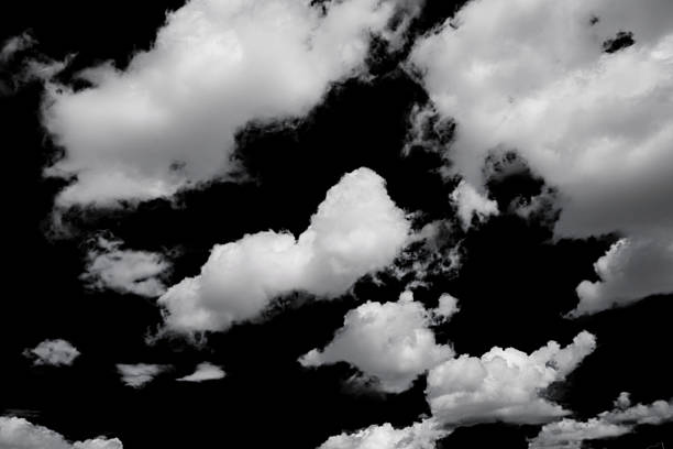 istock white fluffy clouds isolated on a black background, clipart 2239881502