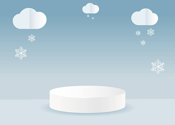 istock A blue backdrop for Christmas and winter holidays. A white podium and clouds with snowflakes in a cut-out paper style. 2239884004