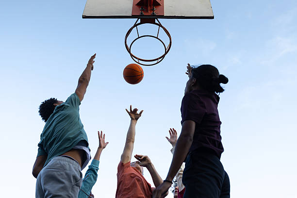 istock Competitive Teens Jumping for Basketball 2239885982