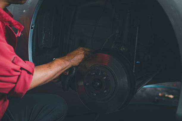istock Mechanic repairing car brake system in workshop 2239886178