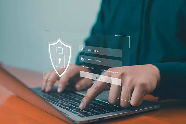 istock Business professional typing login information on laptop with digital security interface, representing cybersecurity, data protection, online privacy, and secure access system for digital business 2239889093