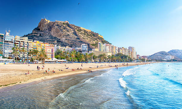 Postiguet Beach is a popular urban beach located at the foot of Mount Benacantil in Alicante, Spain