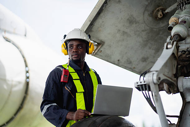 istock Aircraft maintenance engineer inspecting airplane engine with safety equipment and tools, aviation mechanic ensuring aircraft repair, safety check, and technical engineering service. 2239897155