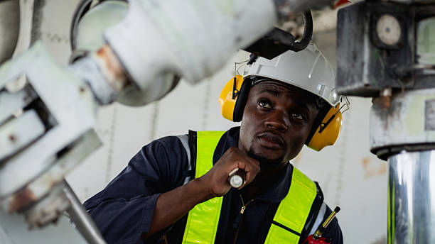 istock Aircraft maintenance engineer inspecting airplane engine with safety equipment and tools, aviation mechanic ensuring aircraft repair, safety check, and technical engineering service. 2239897376