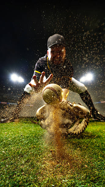 istock Baseball catcher reaching for ball with explosion of sand under 3D stadium lighting 2239897489