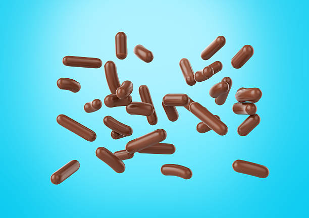 istock Chocolate Sprinkles For Cakes, Ice Cream And Desserts Falling On Cyan Background 3D Illustration 2239902566