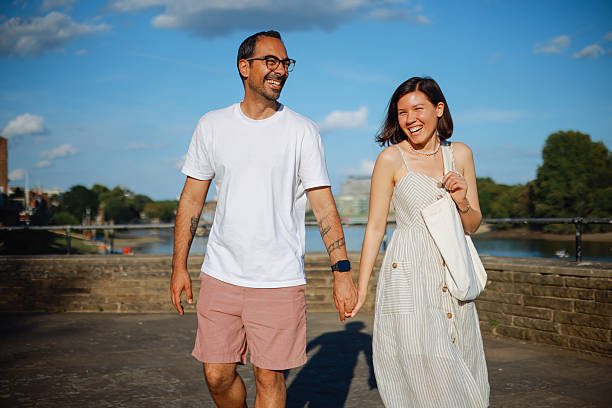 istock Young couple talking and pointing with Hammersmith Bridge in the background 2239903864