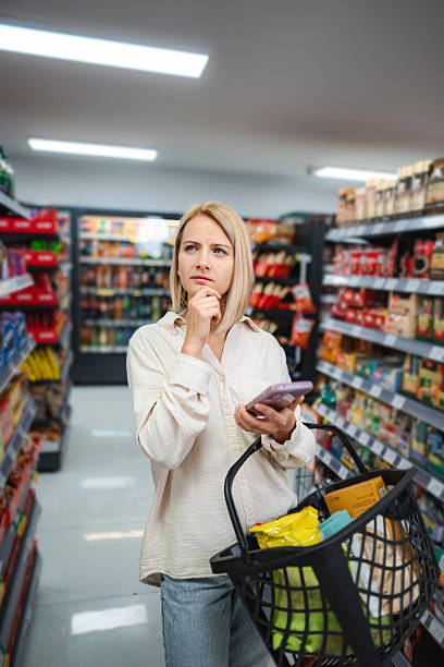 istock Woman shopping in grocery store 2239904113