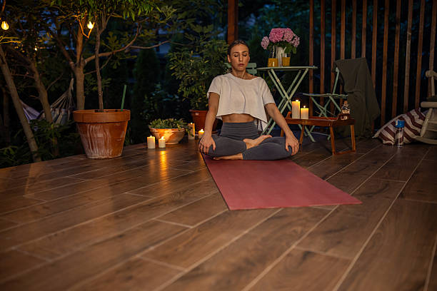 istock Young Woman Practicing Yoga Outdoors in a Tranquil Evening Setting 2239905825