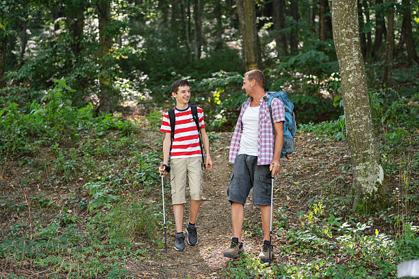 istock Hiking Conversation Between Father and Son in Nature 2239906701