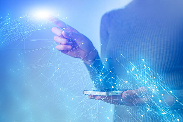 istock A woman is holding a cell phone and pressing a button 2239906900