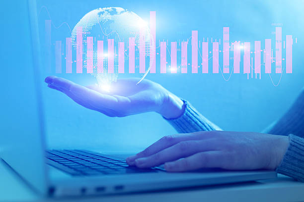 istock A woman is holding a laptop and typing on it 2239906991
