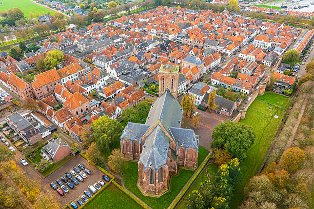 Elburg ancient walled town seen from above during a beautiful autumn day in Gelderland, Netherlands. Elburg used to be a fishing town, but now is more focussed on tourism for its location close to the Veluwemeer and Veluwe as popular tourist destinations.