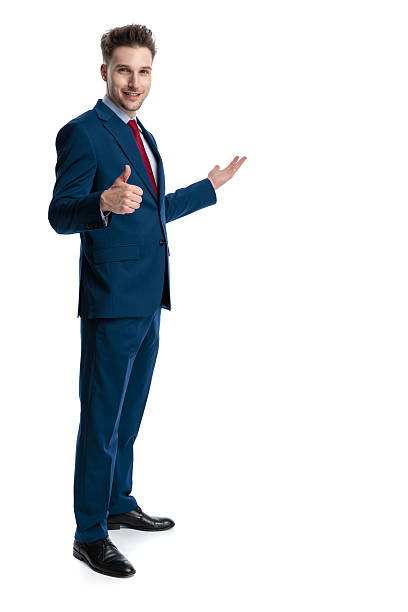 istock handsome elegant man presenting to side and making like gesture 2239911399