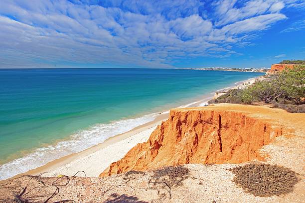 istock Red cliffs and blue sea near Albufeira Algarve 2239913654