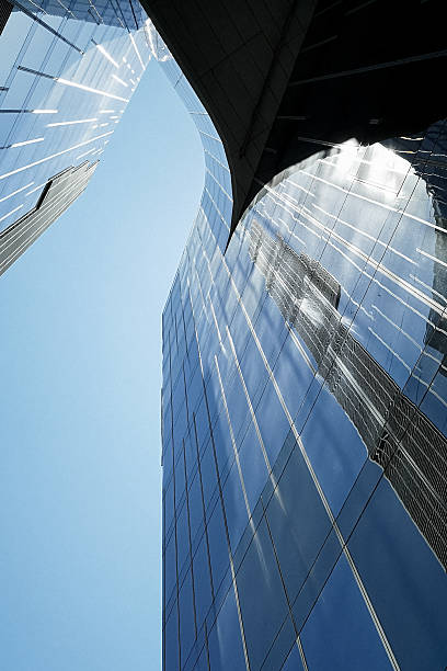 istock Abstract View of Modern Glass Buildings Reflecting Light and Sky 2239914367