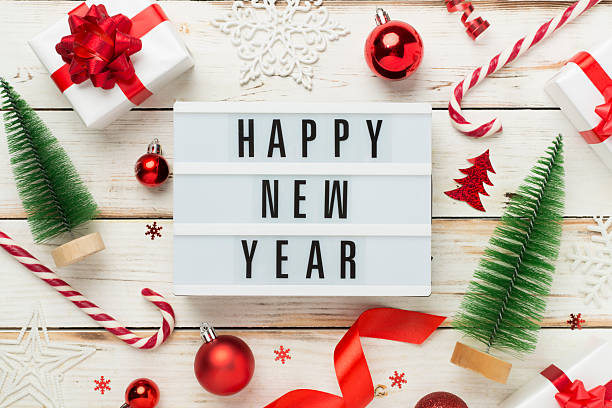 istock Happy New Year with decor on wooden background, top view 2239914659
