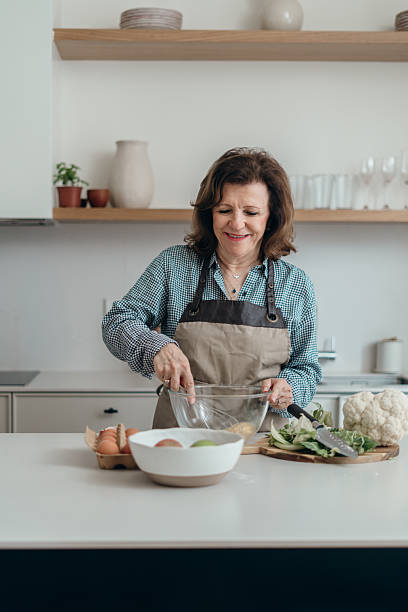 istock Woman cooking in the kitchen 2239914762