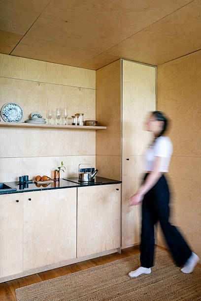 istock Modern wooden kitchen design with storage and cooking space in a comfortable home 2239916056