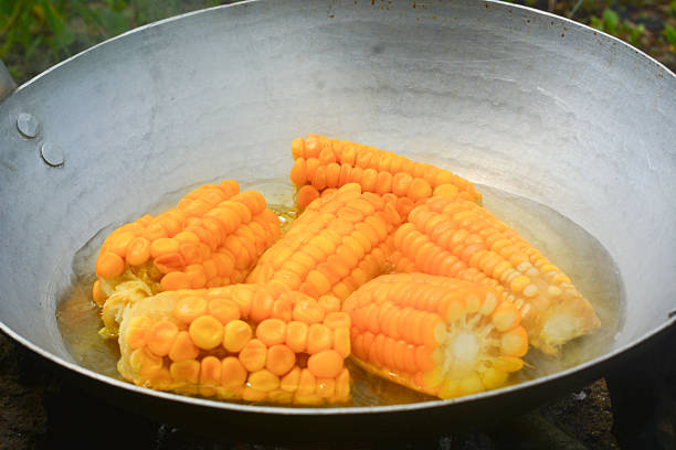 Freshly shelled corn is ready to cook in a pot - close up.