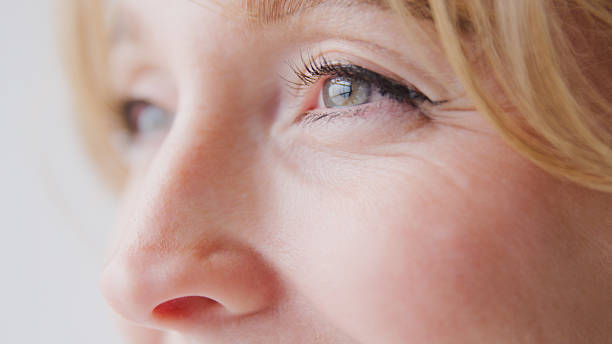 istock Close Up Studio Shot Of Woman's Eye Against Plain Studio Background 2239917461
