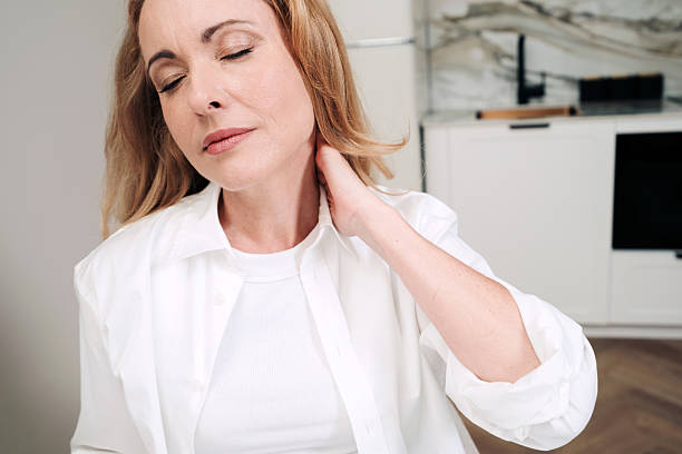 istock Woman working in a home office feeling discomfort while using a laptop 2239917612