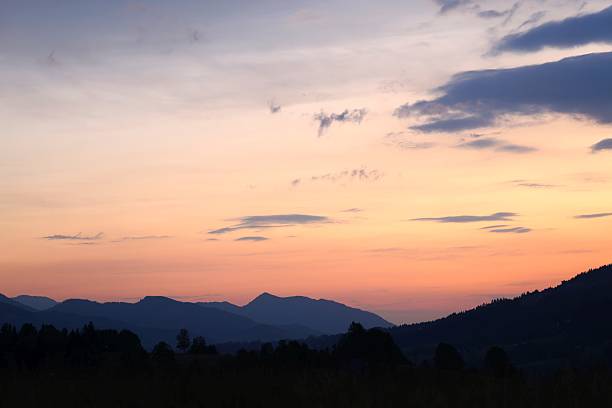 istock serene Vibrant Sunset Over Silhouetted Mountains 2239920495