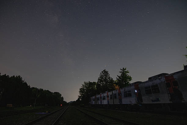 istock Astrophotography: Starry Night Sky with the Milky Way Arching Over the Old Train Station 2239923173
