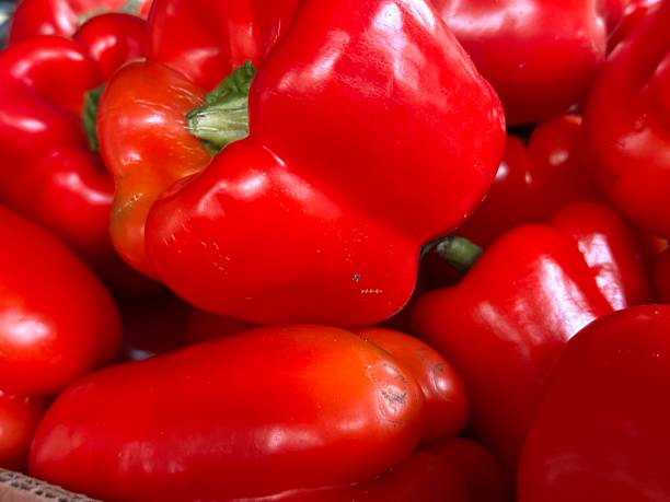 istock Bright Red Bell Peppers in a Market Display 2239925967