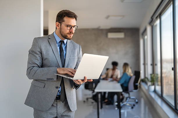 istock A stock trader sits at his office desk using a laptop, analyzing financial markets and portfolios 2239927167