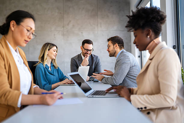 istock Multicultural professional businesspeople working together on research plan in boardroom. 2239928248