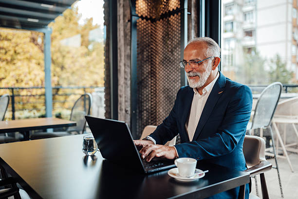 istock Engaged businessman typing on his laptop at table 2239928441